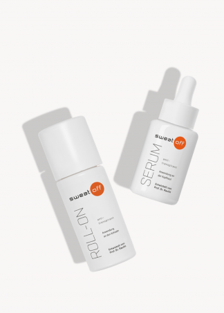 Klassischer Roll-On liegt neben Antitranspirant Serum